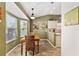 Cozy breakfast nook with a sunlit bay window and adjacent to the kitchen at 1555 Ward Ct, The Villages, FL 32162