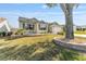 Well-manicured front lawn with stone-edged flower beds frames this charming home at 1555 Ward Ct, The Villages, FL 32162