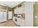 Bright kitchen features stainless steel appliances, plenty of cabinet storage at 1555 Ward Ct, The Villages, FL 32162