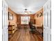 Comfortable home office features wood floors, ceiling fan and plenty of natural light at 1555 Ward Ct, The Villages, FL 32162