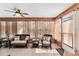 Bright sunroom with tile flooring and comfortable wicker seating at 1555 Ward Ct, The Villages, FL 32162