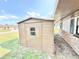 Exterior view showcasing a convenient storage shed in a well-maintained yard at 1611 Canal Ct, Tavares, FL 32778