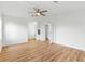 Bedroom with light wood floors, walk-in closet, and en-suite bathroom at 1616 Bayhill Dr, The Villages, FL 32159
