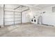 Spacious garage with white door, washer and dryer hookups, and a water heater at 1616 Bayhill Dr, The Villages, FL 32159