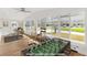 Sunlit recreation room featuring a foosball table, workspace, and large windows offering outdoor views at 1616 Bayhill Dr, The Villages, FL 32159