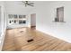 Bright sun room with breakfast bar, light wood floors, and many windows at 1616 Bayhill Dr, The Villages, FL 32159