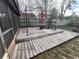 Outdoor deck in the backyard, featuring a gazebo, table, chairs, and fire pit at 167 N Cervidae Dr, Apopka, FL 32703