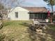 View of the backyard featuring a fire pit, screened in porch and wooden deck with outdoor seating at 167 N Cervidae Dr, Apopka, FL 32703