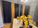 Stylish bathroom with a modern vanity, decorative mirror, and black and gold shower curtains, creating a spa-like atmosphere at 167 N Cervidae Dr, Apopka, FL 32703