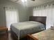 Bedroom with a queen size bed, a ceiling fan and natural lighting from the windows at 167 N Cervidae Dr, Apopka, FL 32703