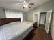 Bedroom with a queen size bed, a ceiling fan, natural lighting and a closet at 167 N Cervidae Dr, Apopka, FL 32703