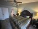 Comfortable bedroom featuring carpet flooring, a cozy bed, and soft lighting, creating a peaceful atmosphere for restful nights at 167 N Cervidae Dr, Apopka, FL 32703