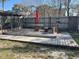A wooden deck contains an outdoor dining area and seating area at 167 N Cervidae Dr, Apopka, FL 32703