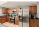 Well-equipped kitchen with stainless steel appliances, ample cabinet space, and dark countertops at 16825 Sunrise Vista Dr, Clermont, FL 34714