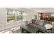 Open living room with a view of the pool and access to the kitchen at 16825 Sunrise Vista Dr, Clermont, FL 34714
