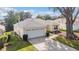 Single-story house with a two-car garage and a well-maintained lawn at 17145 Se 93Rd Yondel Cir, The Villages, FL 32162