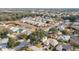 Aerial showing neighborhood homes, landscape, and pond at 17145 Se 93Rd Yondel Cir, The Villages, FL 32162