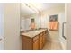 Main bathroom with granite vanity and a walk-in shower at 17145 Se 93Rd Yondel Cir, The Villages, FL 32162