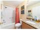 Clean bathroom featuring a tub, shower, granite countertop, and colorful art at 17145 Se 93Rd Yondel Cir, The Villages, FL 32162