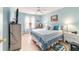 Bedroom with a queen-size bed and light blue walls at 17145 Se 93Rd Yondel Cir, The Villages, FL 32162