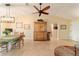 Charming dining room with a wooden table and chairs, and a view to the kitchen at 17145 Se 93Rd Yondel Cir, The Villages, FL 32162