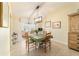 Bright dining area with a table for six and access to a sunroom at 17145 Se 93Rd Yondel Cir, The Villages, FL 32162
