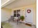 Covered front porch with seating and a welcoming atmosphere at 17145 Se 93Rd Yondel Cir, The Villages, FL 32162
