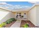 Front porch with two comfy chairs and lush greenery at 17145 Se 93Rd Yondel Cir, The Villages, FL 32162