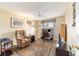 Bright home office with a comfortable recliner, workspace, and ceiling fan at 17145 Se 93Rd Yondel Cir, The Villages, FL 32162