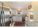 Updated kitchen with stainless steel appliances and granite counters at 17145 Se 93Rd Yondel Cir, The Villages, FL 32162