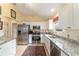 Modern kitchen with stainless steel appliances and granite countertops at 17145 Se 93Rd Yondel Cir, The Villages, FL 32162