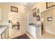 Kitchen features granite countertops and white cabinets at 17145 Se 93Rd Yondel Cir, The Villages, FL 32162