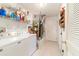 Laundry room with washer, dryer, and ample storage shelving at 17145 Se 93Rd Yondel Cir, The Villages, FL 32162