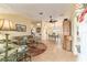 Spacious living room featuring a comfy sectional sofa and tile floors at 17145 Se 93Rd Yondel Cir, The Villages, FL 32162