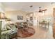 Bright and airy living room with a view into dining area at 17145 Se 93Rd Yondel Cir, The Villages, FL 32162