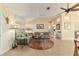 Open living room with a sectional sofa and neutral color scheme at 17145 Se 93Rd Yondel Cir, The Villages, FL 32162