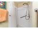 Walk-in shower with grab bars and tiled walls at 17145 Se 93Rd Yondel Cir, The Villages, FL 32162