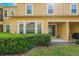 Picture of backyard featuring a trimmed bush in front of the house at 17523 Promenade Dr, Clermont, FL 34711