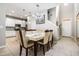 Elegant dining room with a modern chandelier and white table at 17523 Promenade Dr, Clermont, FL 34711