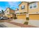 Beautiful townhomes featuring brick-paved driveways and lush landscaping at 17523 Promenade Dr, Clermont, FL 34711