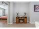 Stylish fireplace with a wooden mantel and a view into the Primary bedroom at 17523 Promenade Dr, Clermont, FL 34711