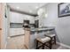 Modern kitchen featuring granite countertops and stainless steel appliances at 17523 Promenade Dr, Clermont, FL 34711