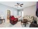 Cozy living room featuring neutral walls, ceiling fan, and a modern layout at 17523 Promenade Dr, Clermont, FL 34711
