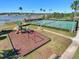 Community playground, tennis courts and recreation area by the lake at 17523 Promenade Dr, Clermont, FL 34711