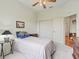 Inviting bedroom featuring a ceiling fan, and a window with natural light at 17652 Se 120Th Ter, Summerfield, FL 34491