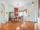 Formal dining room featuring hardwood floors and bright lighting at 17652 Se 120Th Ter, Summerfield, FL 34491
