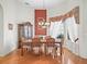 Traditional dining room featuring hardwood floors, a chandelier, and a decorative china cabinet at 17652 Se 120Th Ter, Summerfield, FL 34491