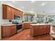 Kitchen featuring wood floors, stainless steel appliances and spacious counter tops at 17652 Se 120Th Ter, Summerfield, FL 34491