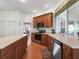 Kitchen featuring stainless steel appliances, wood floors, lots of storage, and a large island at 17652 Se 120Th Ter, Summerfield, FL 34491