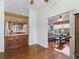 Open-concept with hardwood floors, an open kitchen, and a comfortable living room at 17652 Se 120Th Ter, Summerfield, FL 34491
